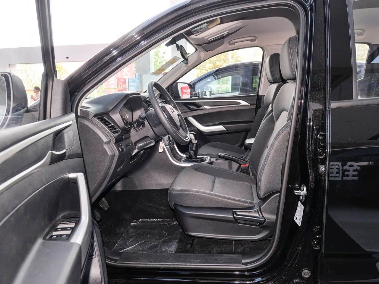 SAIC Maxus T60 driver seat door open side view