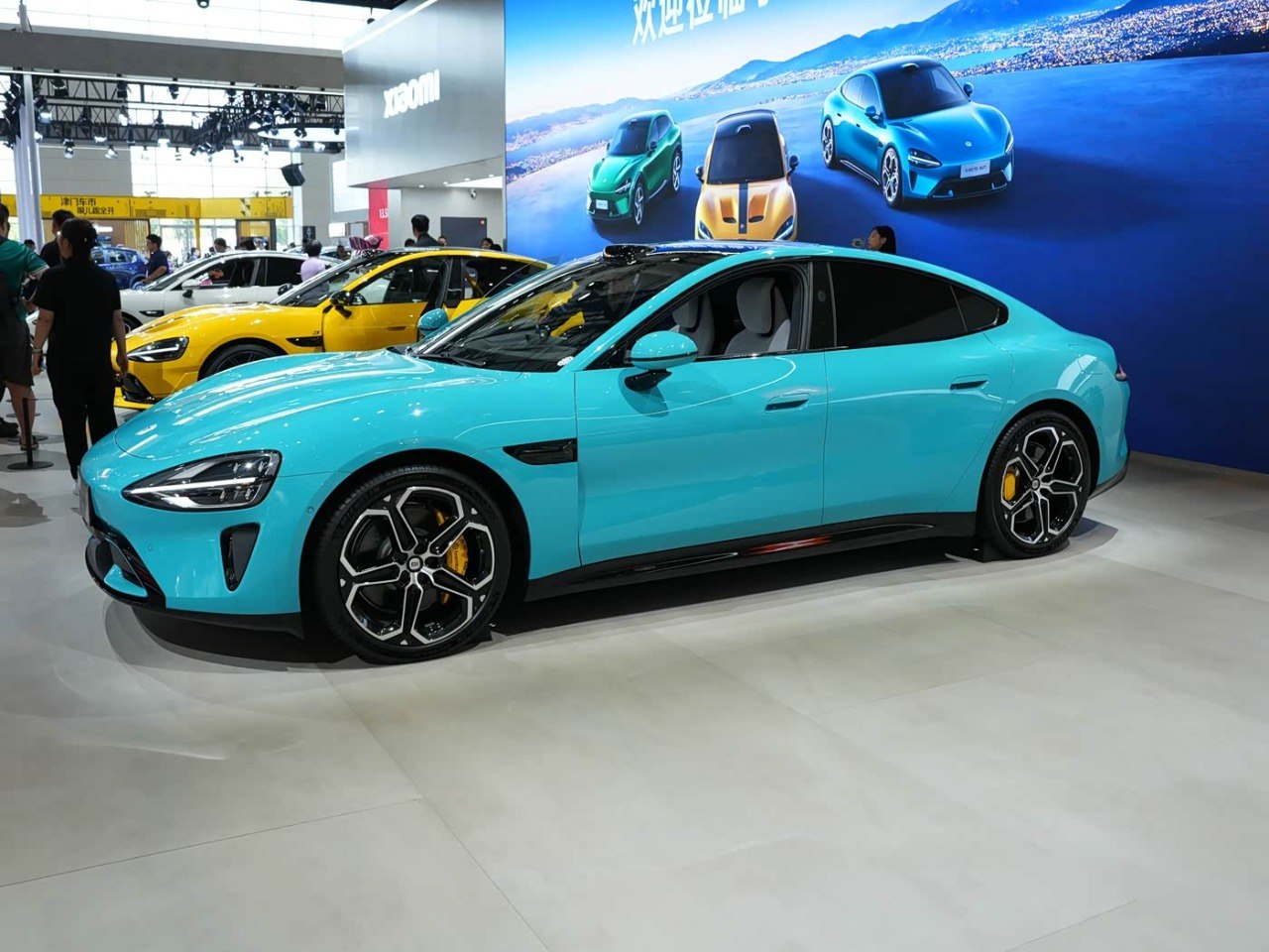 Xiaomi SU7 2026 teal cyan color at showroom